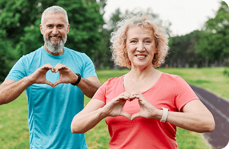Couple making hearts with their hands